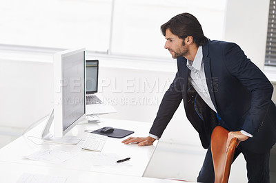Buy stock photo Standing, business and man with a computer, professional and office with consultant or employee. Pc, person or entrepreneur in a workplace or online reading for blog with accountant or financial news