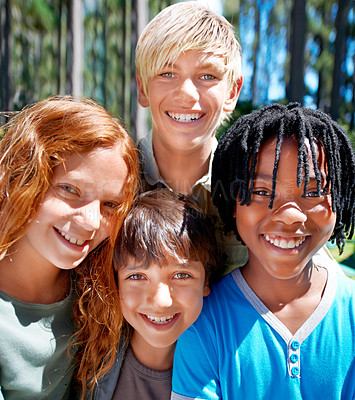 Buy stock photo A diverse group of kids smiiing while standing outside in the woods