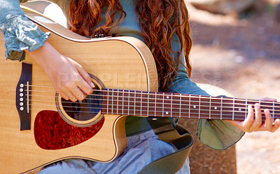 Buy stock photo Nature, camp and closeup of girl with guitar for entertainment, talent or music in woods or forest. Playing, musician and child with acoustic string instrument outdoor in park on weekend trip.
