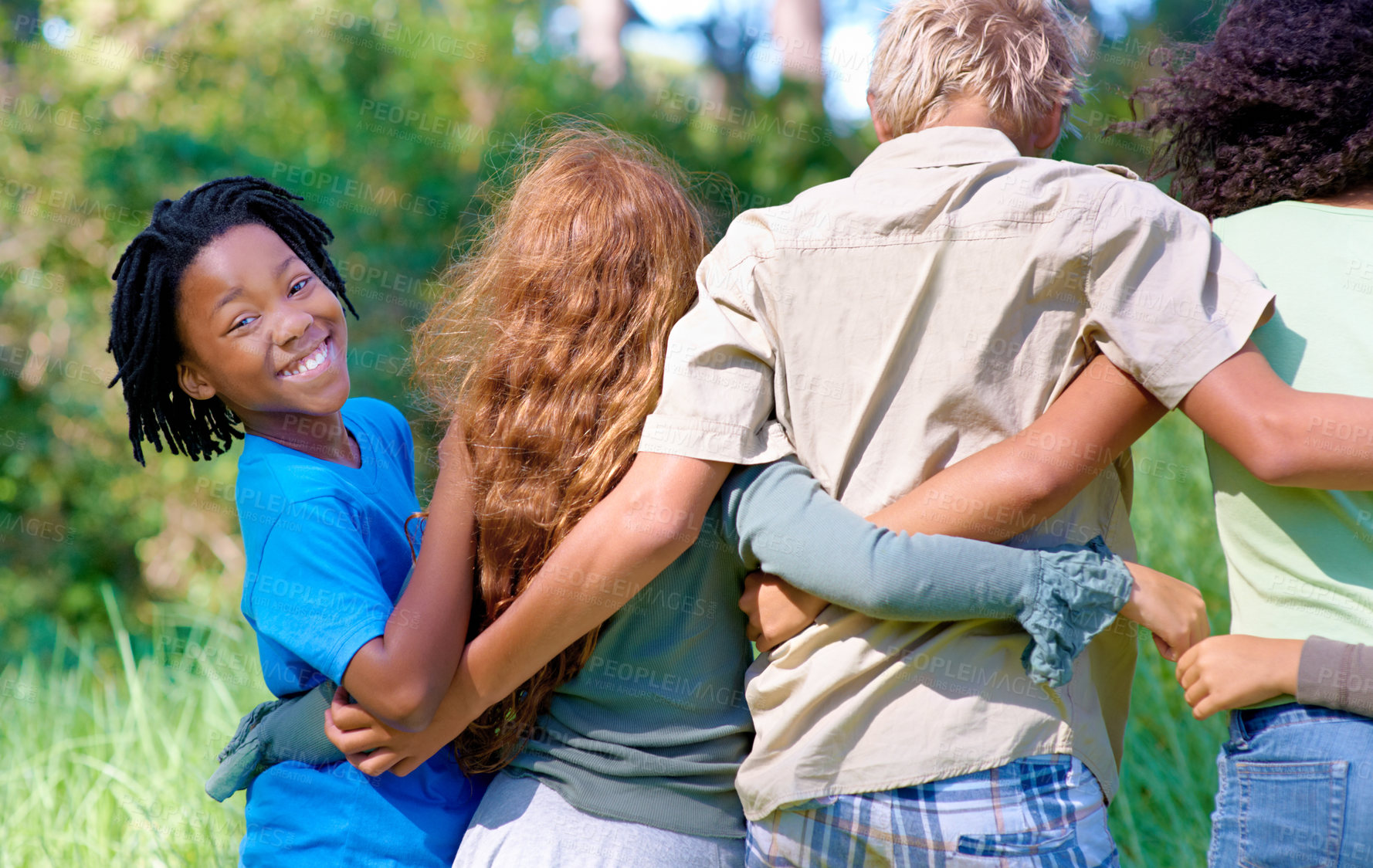 Buy stock photo Boy, friends and embrace in portrait on outdoor adventure, support and bonding on camping trip. Black male person, children and smile in hug for love, nature and happy in forest or woods on vacation