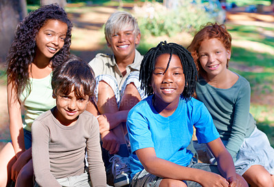 Buy stock photo A group of children smiling at the camera in the outdoors