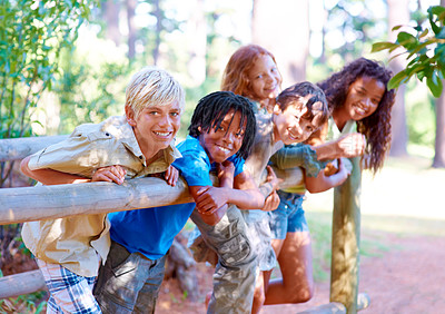 Buy stock photo Smile, portrait and diversity on bridge with kids in nature for summer camping in forest, vacation and explore. Sunshine, children and together outdoors for camp, happiness and unity for support
