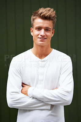 Buy stock photo Portrait of a handsome young man standing outside