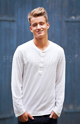 Buy stock photo Portrait of a handsome young man standing outside