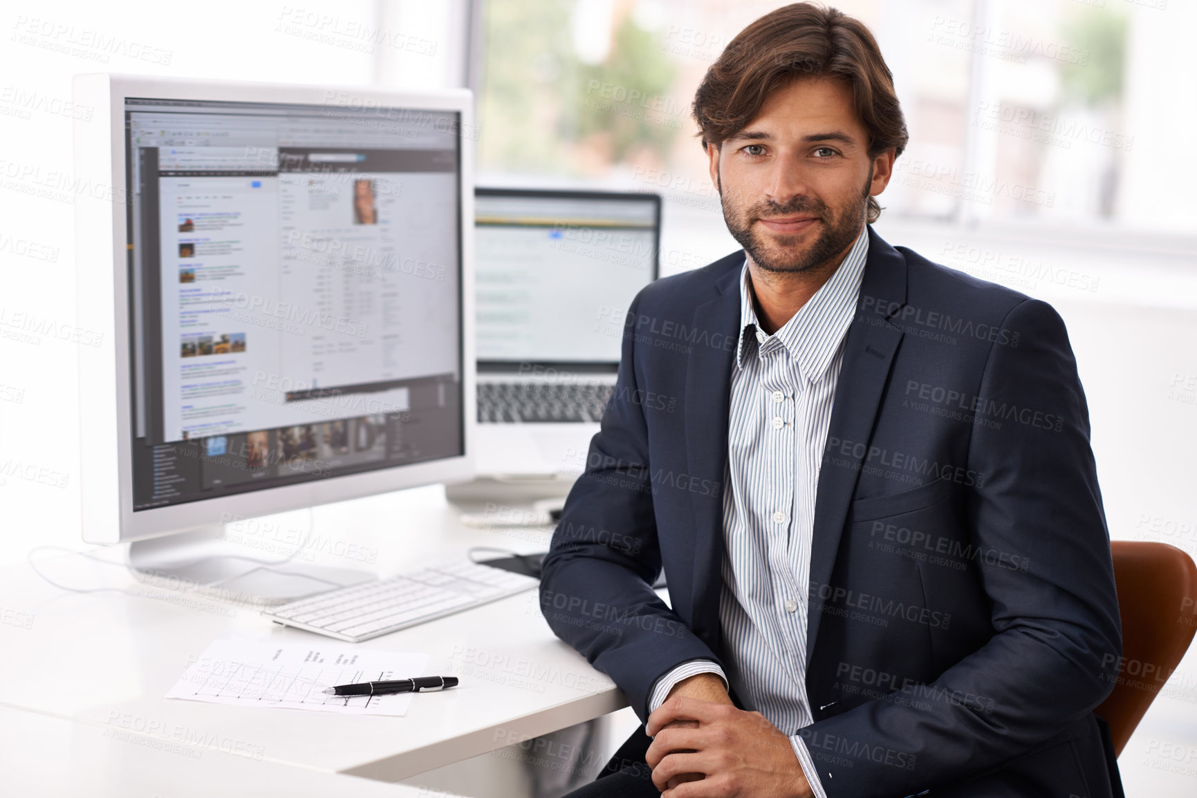 Buy stock photo Portrait, computer and business man at desk in office for research, information or development. Company, website or homepage with confident young employee in professional workplace for career
