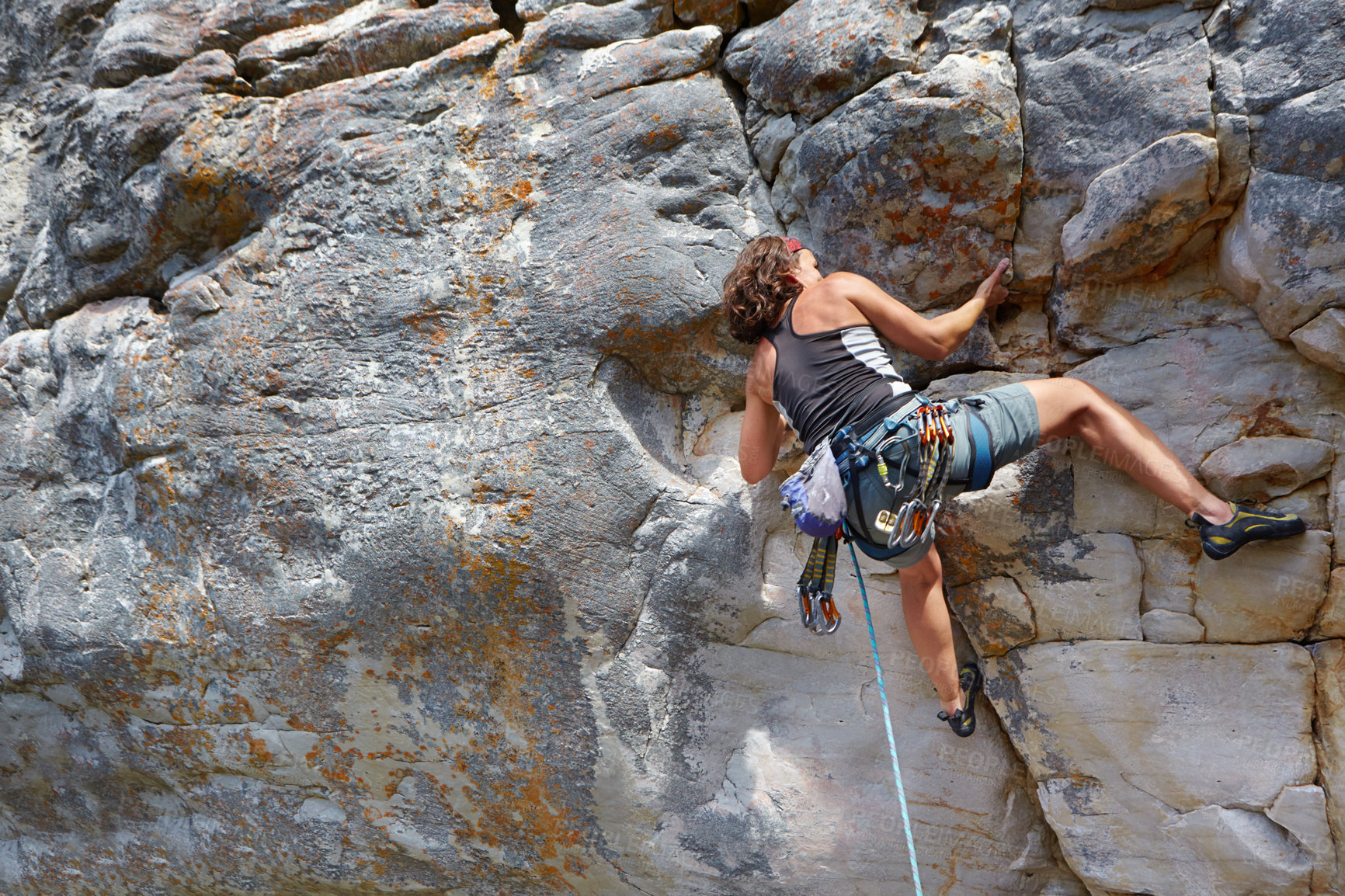 Buy stock photo Rock climbing, fitness and travel with woman on mountain for adventure, challenge and explore. Strong, freedom and hiking with female climber training in nature for courage, safety and workout