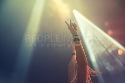 Buy stock photo Dark, concert and excited woman with arms raised cheering for fun performance with culture. Party, event and new years eve with a female person celebrating nightlife entertainment  and disco 