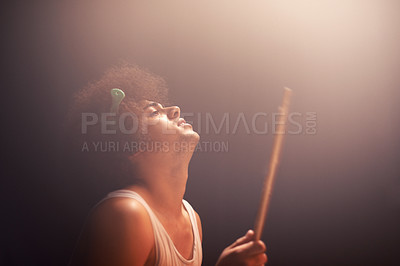 Buy stock photo Man, drummer and musician in performance at rock concert, music festival on stage and talent. Person, artist and play on drumstick for entertainment, sound and rehearsal on percussion instrument 
