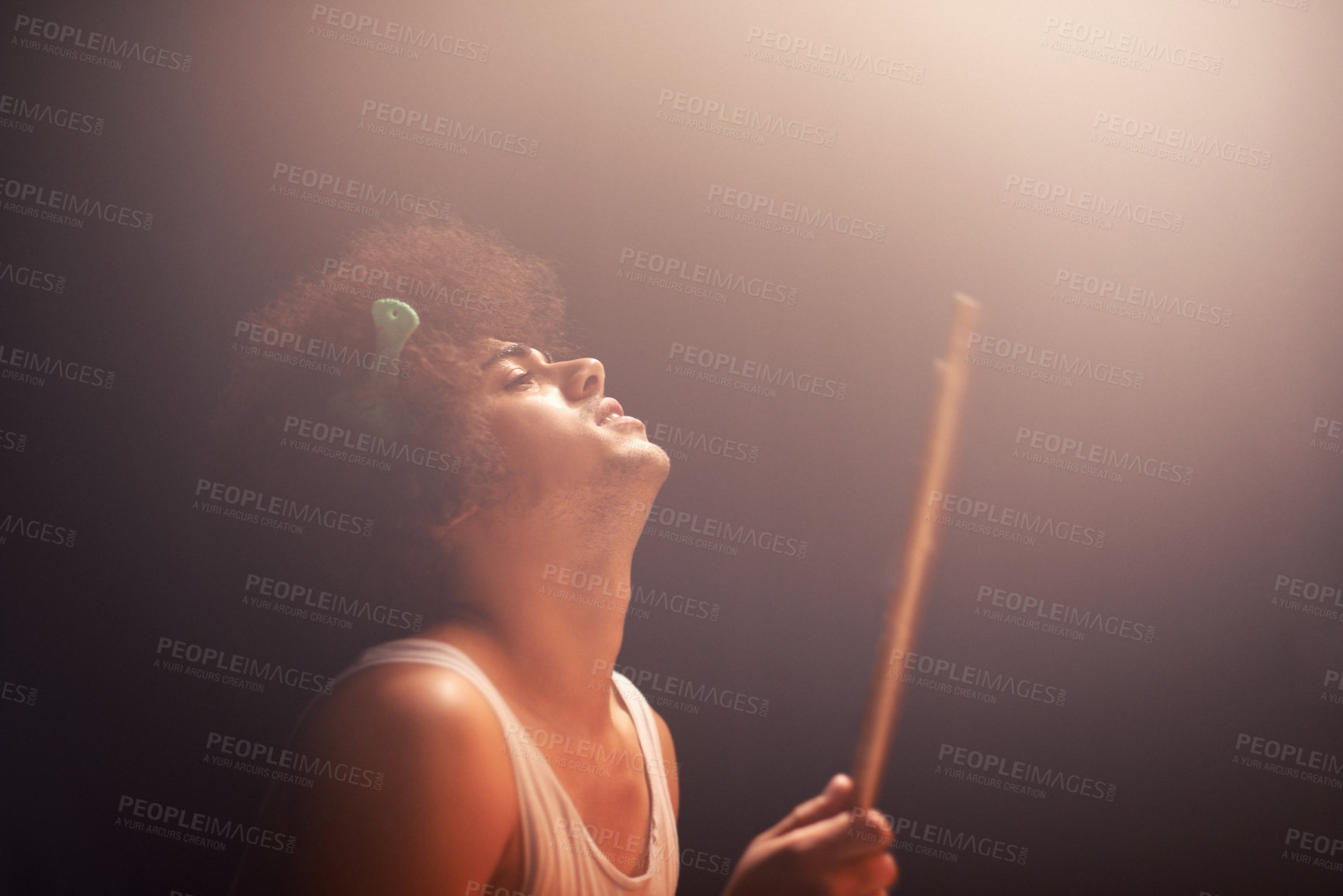 Buy stock photo Man, drummer and musician in performance at rock concert, music festival on stage and talent. Person, artist and play on drumstick for entertainment, sound and rehearsal on percussion instrument 