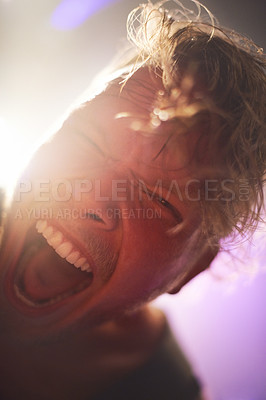 Buy stock photo Portrait, closeup and man screaming for rockstar performance at concert for entertainment at night. Culture, yelling and face of musician male person with energy at festival for artistic expression