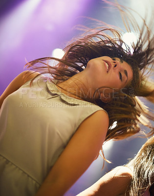 Buy stock photo Music, concert and woman dancing at festival, party or celebration at social event at night. Sound, rhythm and young person at nightclub, disco or energy of fan at rave on holiday for entertainment