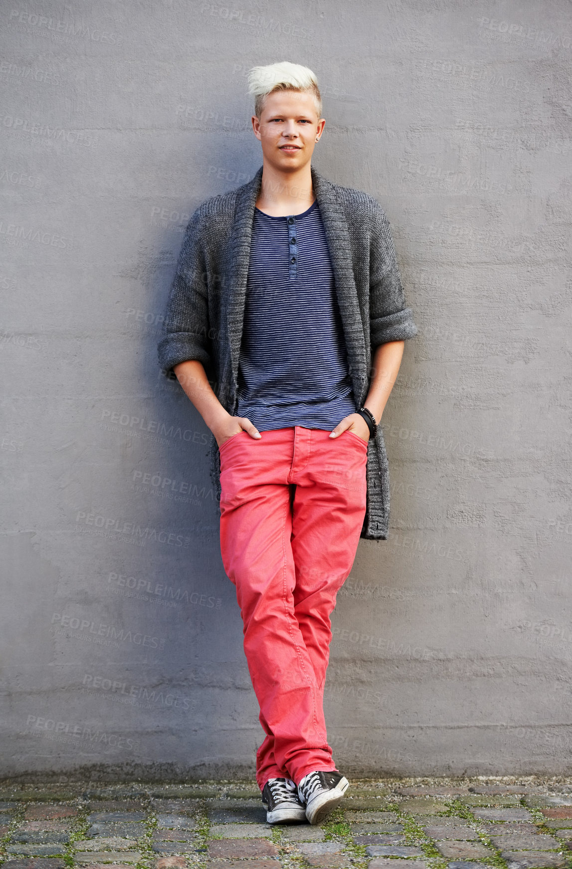 Buy stock photo Full length shot a handsome and fashionable young man standing outside with his hands in his pockets