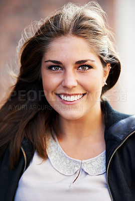 Buy stock photo Portrait of an attractive young woman outdoors in the city