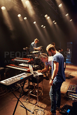 Buy stock photo Electric, keyboard and musician at stage with band for preparation of production for concert. Sound, equipment and people in theater getting ready for creative show with dj, laptop and instruments