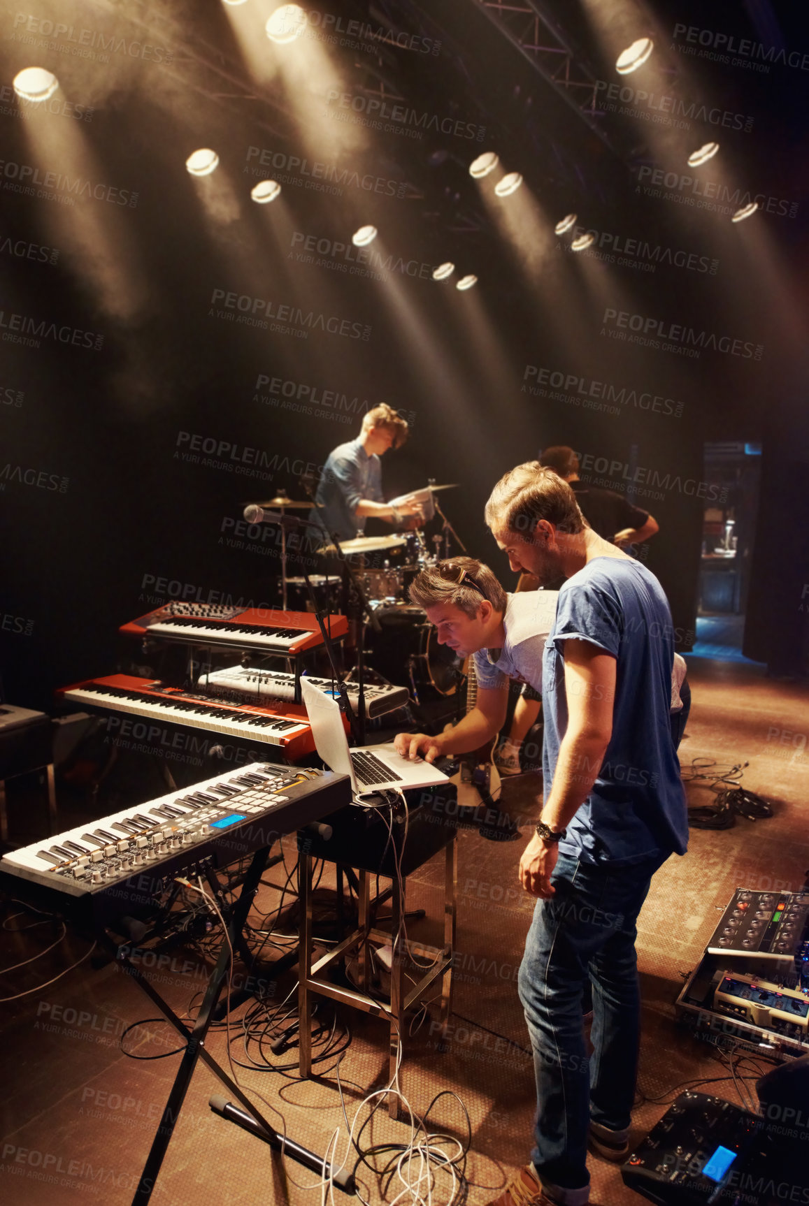 Buy stock photo Electric, keyboard and musician at stage with band for preparation of production for concert. Sound, equipment and people in theater getting ready for creative show with dj, laptop and instruments