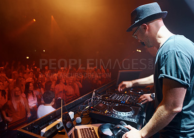 Buy stock photo Night, party or man in music festival to dj for performance or celebration with fans or audience. Stage, concert or musician with lights or crowd of people at a rave event with turntable technology