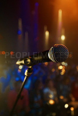 Buy stock photo Microphone, closeup and stage performance in theater with sound equipment for concert or singing. Audio, technology and light in dark room with audience for karaoke, music or event for culture