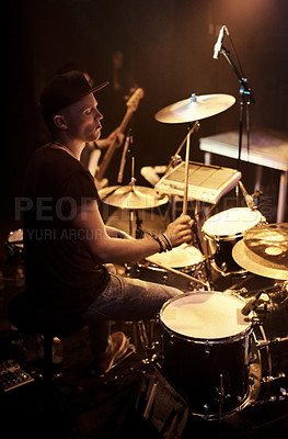 Buy stock photo Music, concert and drummer on stage for band performance with sound equipment or instrument. Party, event or entertainment and musician drumming at festival, show or gig for social celebration