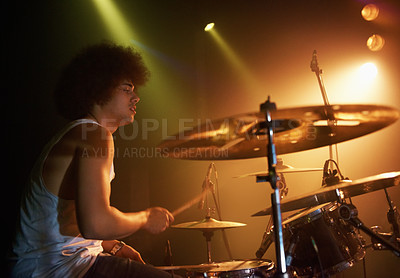 Buy stock photo Stage, performance and man on drums at concert playing jazz, beat and talent for music. Drummer, musician and creative person in theater with rhythm for percussion, instrument or show at night