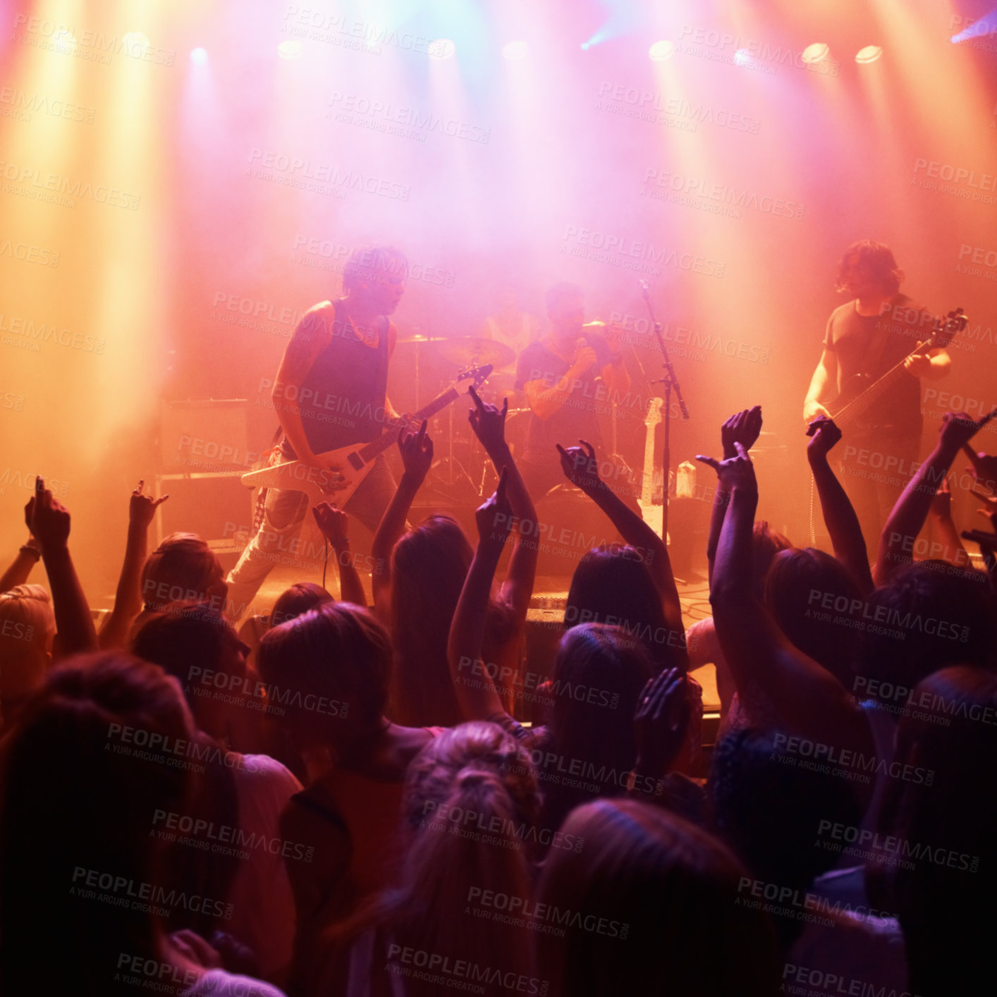 Buy stock photo Rearview of a crowd at a music gig with their hands raised in the air. This concert was created for the sole purpose of this photo shoot, featuring 300 models and 3 live bands. All people in this shoot are model released.