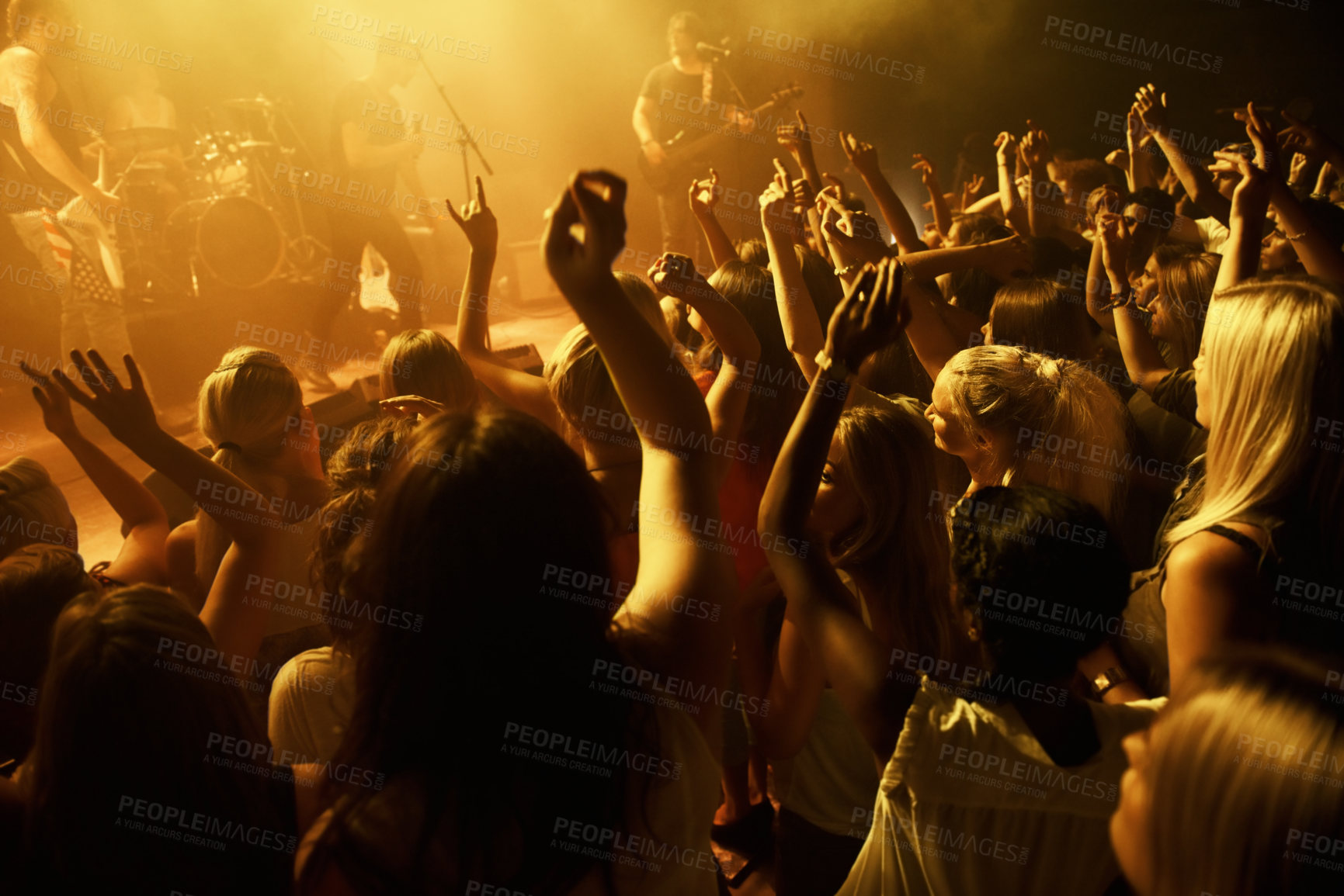 Buy stock photo Shot of a crowd dancing at a rock concert. This concert was created for the sole purpose of this photo shoot, featuring 300 models and 3 live bands. All people in this shoot are model released.