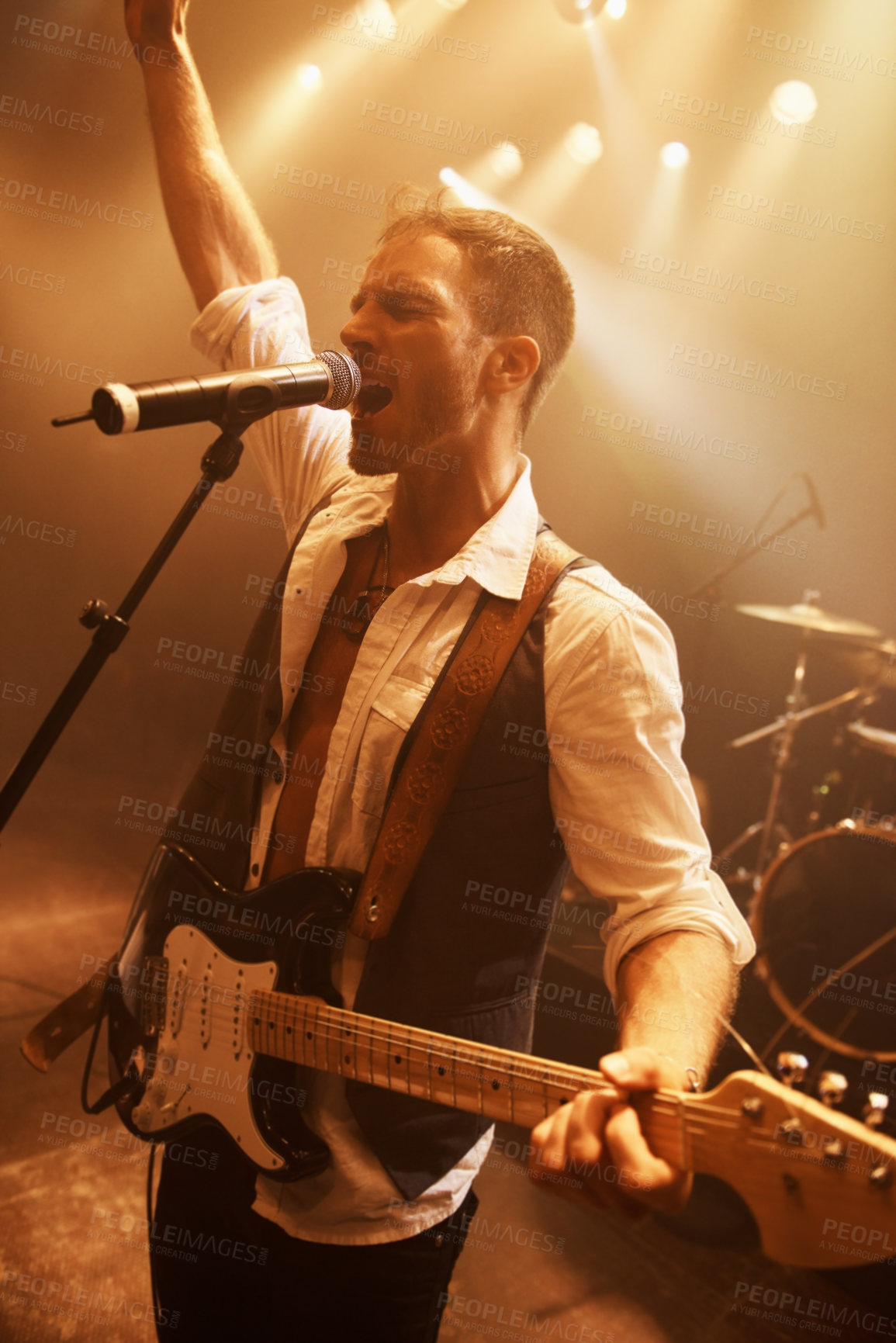 Buy stock photo Night, singer and guitar with man on stage for music, performance and rock show. Event, spotlight and concert with male musician playing instrument at festival club for rave, disco and  celebration