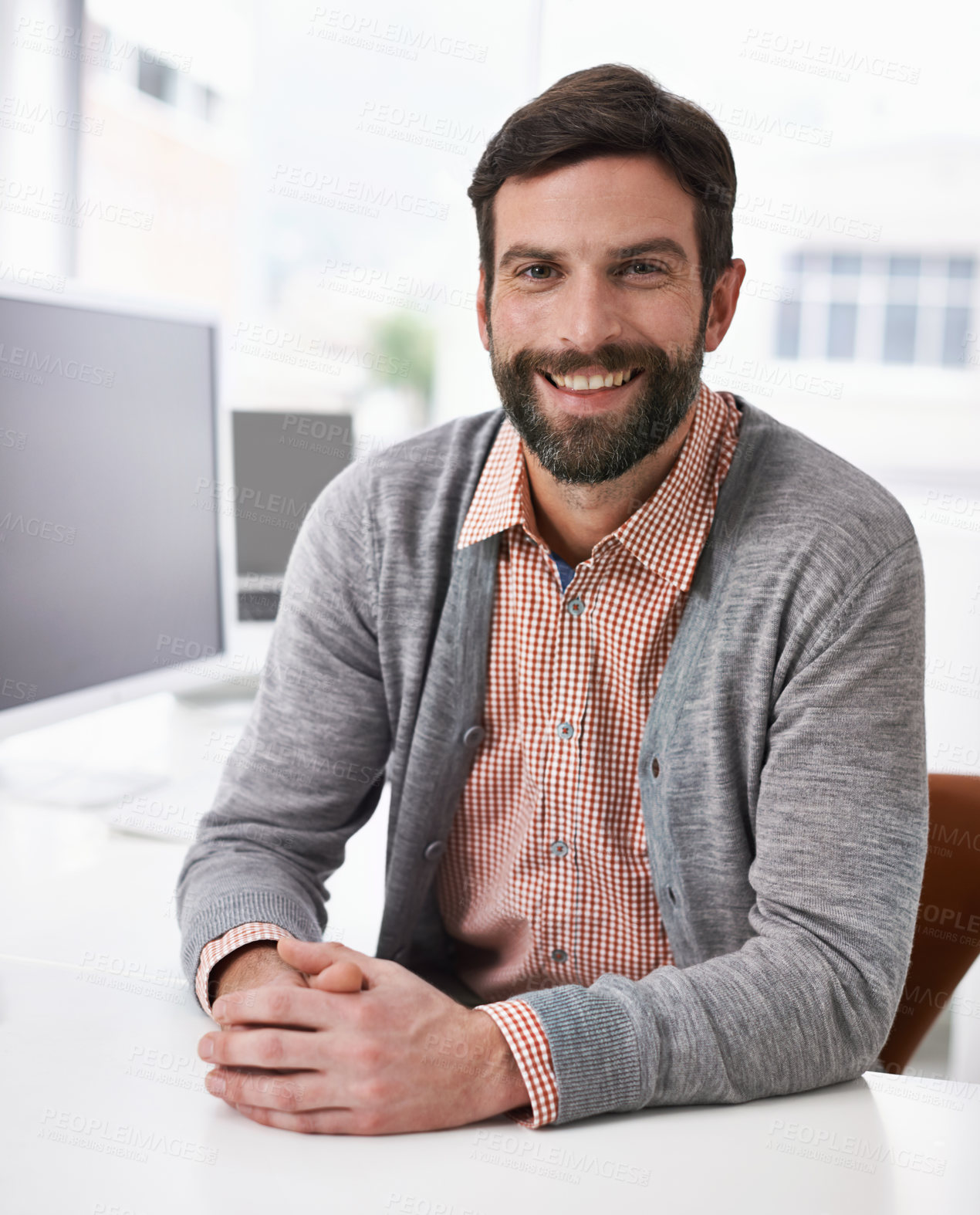 Buy stock photo Portrait, smile and young designer man at desk in office for creative business or artistic career. Face, happy and casual with design employee in company or agency workplace for productivity