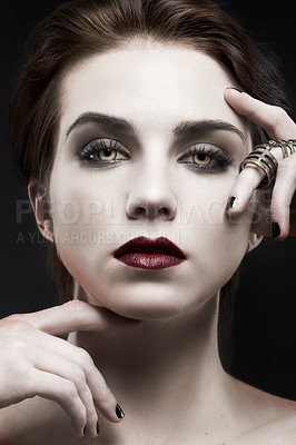 Buy stock photo Beauty, woman and gothic makeup in studio with portrait for cosmetics, art deco aesthetic with edgy jewelry. Face of model in villain character, vampire and red lipstick on a dark or black background