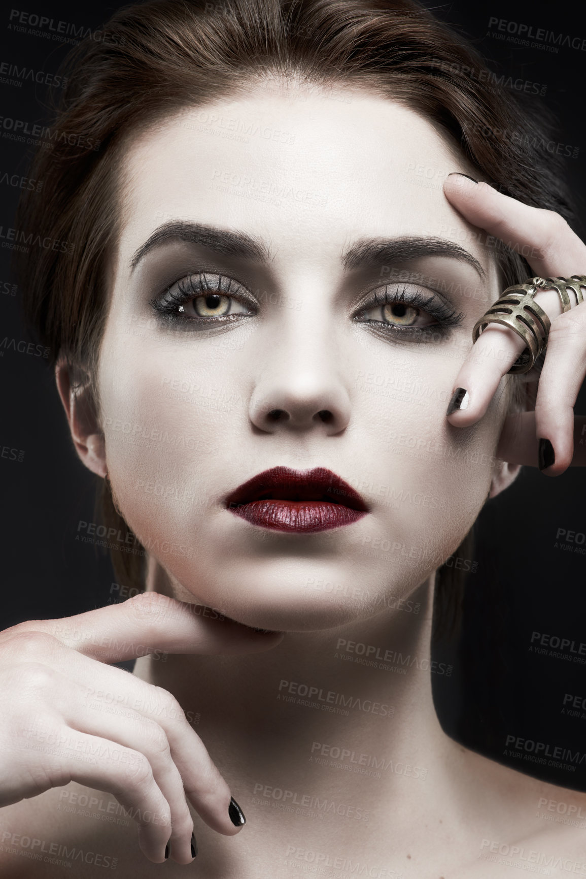 Buy stock photo Beauty, woman and gothic makeup in studio with portrait for cosmetics, art deco aesthetic with edgy jewelry. Face of model in villain character, vampire and red lipstick on a dark or black background