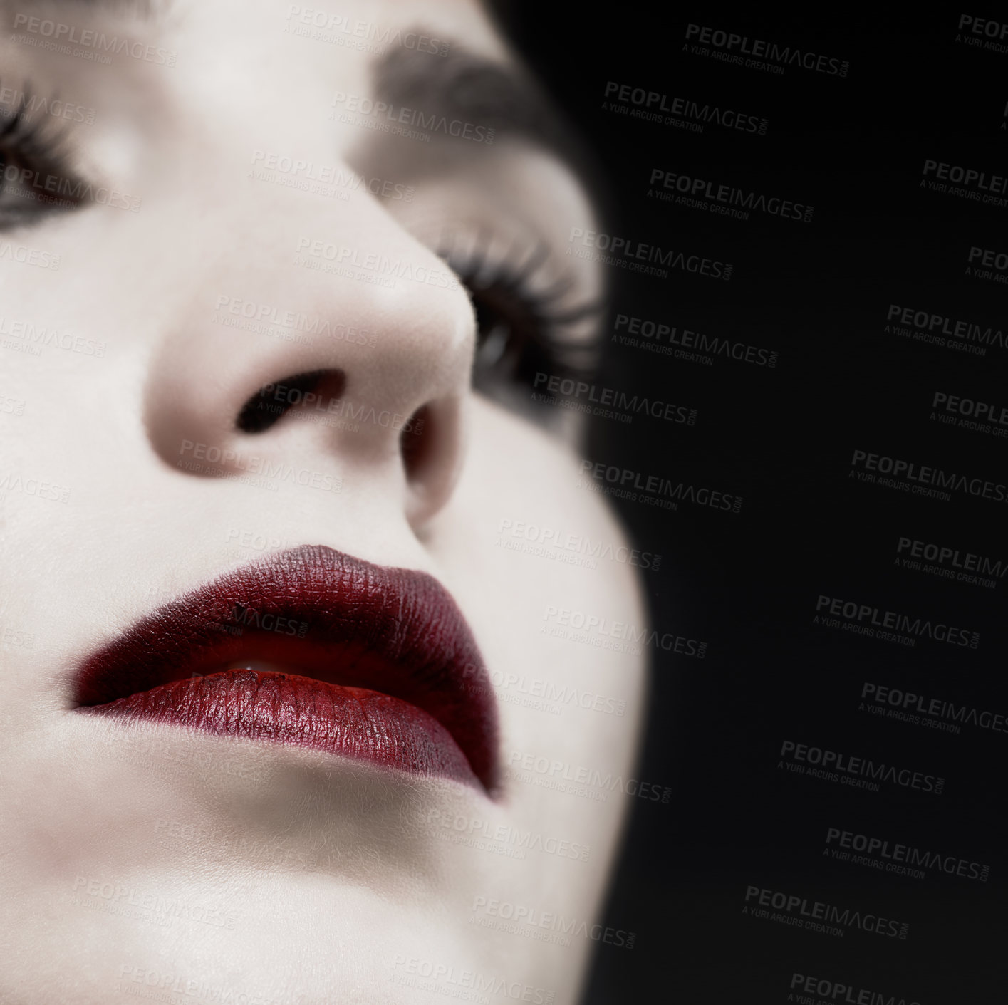 Buy stock photo Woman, lips and gothic makeup in studio for beauty, cosmetics and vampire, witch or dark aesthetic. Face of model with lipstick closeup for Halloween, art and color at night or on a black background