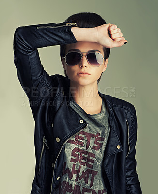 Buy stock photo Woman, studio and punk with confidence, pose and sunglasses for gen z, trendy and fashion. Female rocker, leather jacket and contemporary for expression, tough and edgy portrait with individuality