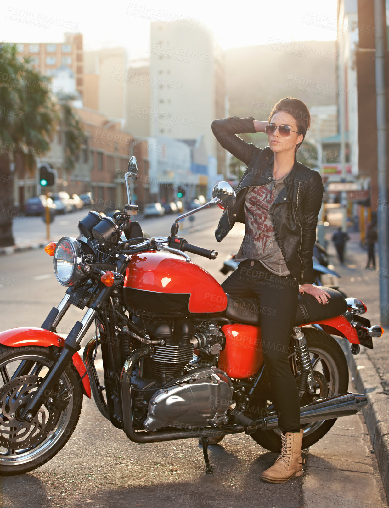 Buy stock photo Bike, fashion and woman in city with sunglasses for travel, transport or road trip as rebel. Leather, asphalt and model with attitude on classic or vintage motorcycle for transportation or journey