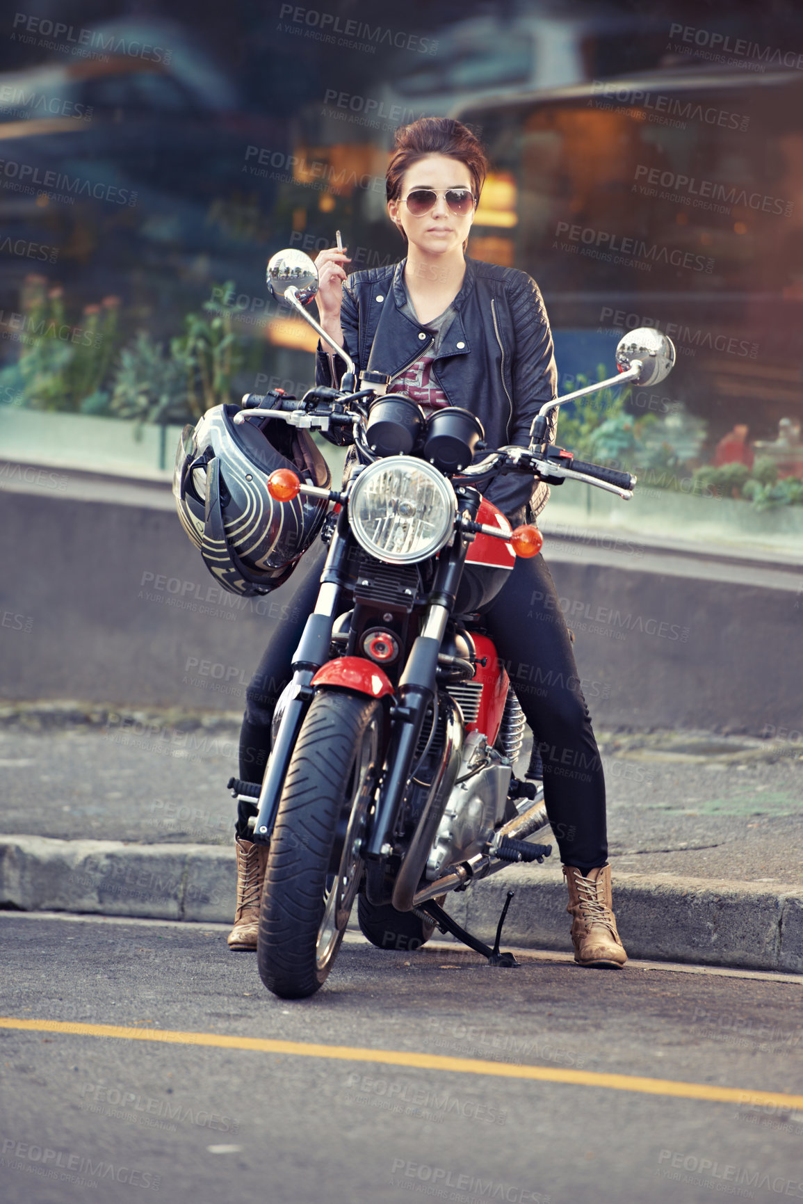 Buy stock photo Motorcycle, leather and woman in city with cigarette for travel, transport or road trip as rebel. Fashion, street and smoke with model on classic or vintage bike for transportation or journey