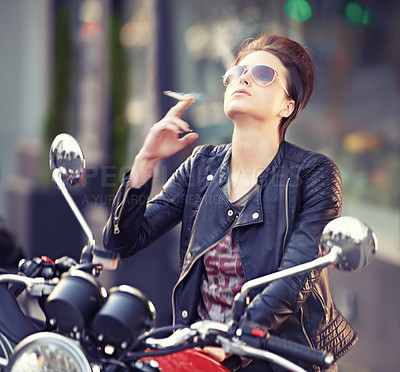 Buy stock photo Woman, leather and cigarette in city with motorcycle for travel, transport or road trip as rebel. Fashion, street and person smoking nicotine with attitude on classic or vintage bike for journey