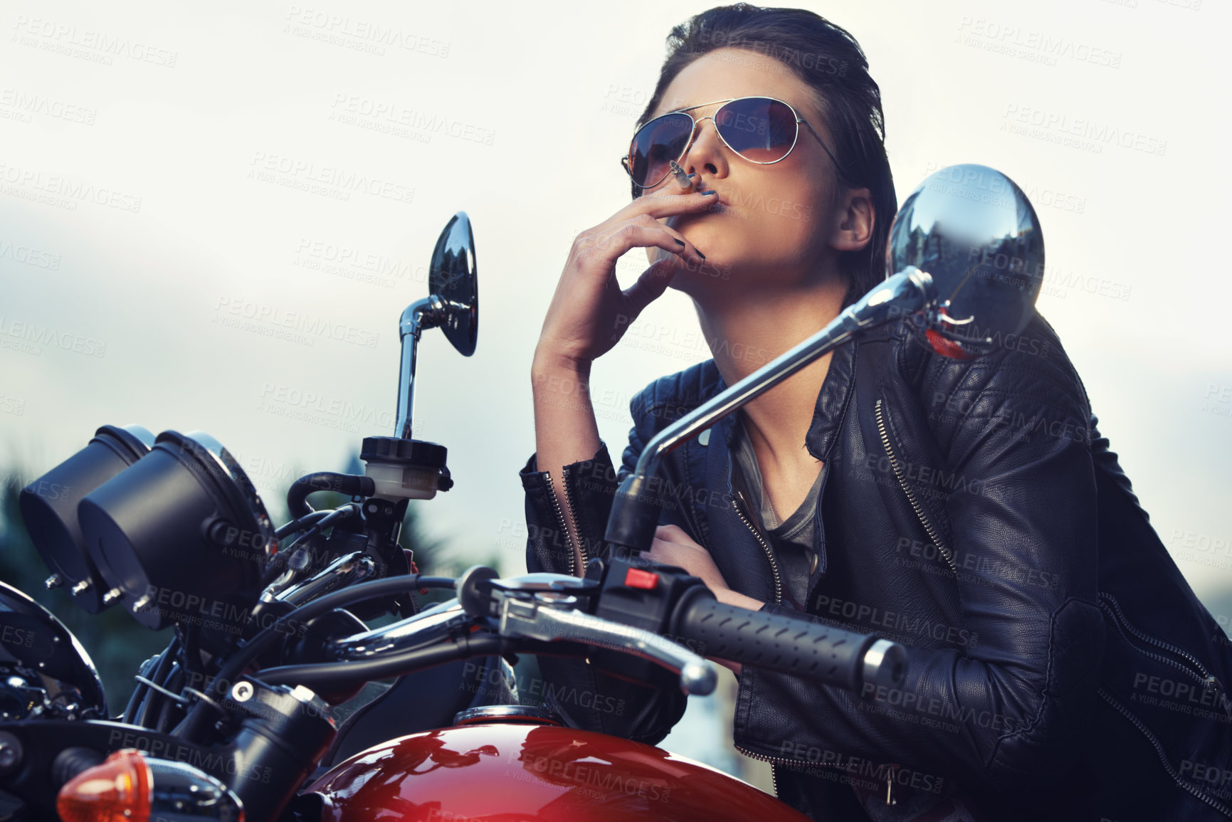 Buy stock photo Bike, leather and woman smoking in city with sunglasses for travel, transport or road trip as rebel. Fashion, model and nicotine with attitude on classic or vintage bike for transportation or journey