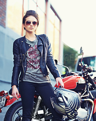 Buy stock photo Shot of a young and stylish female motorcycle rider outside