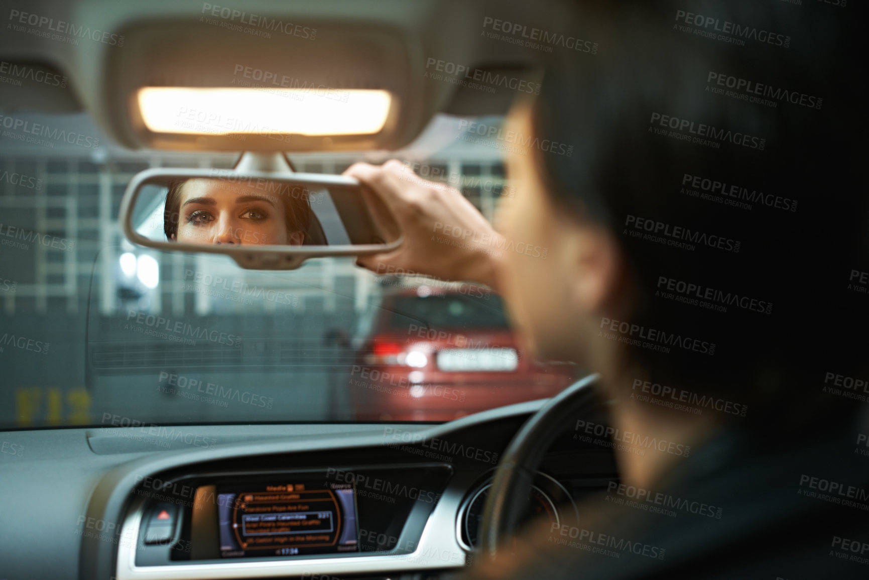 Buy stock photo Woman, car and checking mirror in parking lot for observation, awareness or transportation. Female person or driver looking in rear view reflection for drive, reverse or interior check in vehicle