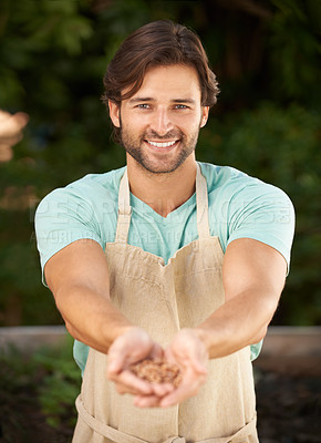 Buy stock photo Man, hands together and seeds in portrait for sustainability, planting and growth in outdoor nursery. Male gardener, face and happy with grains for development, nurture and cultivation for future