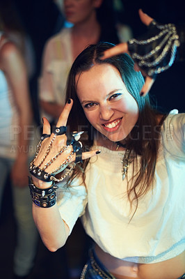 Buy stock photo Woman at concert, fan with rock hands portrait at music festival, fun and new year social event, music and punk fashion gloves. Rock music, live and entertainment at show for Florida festival.