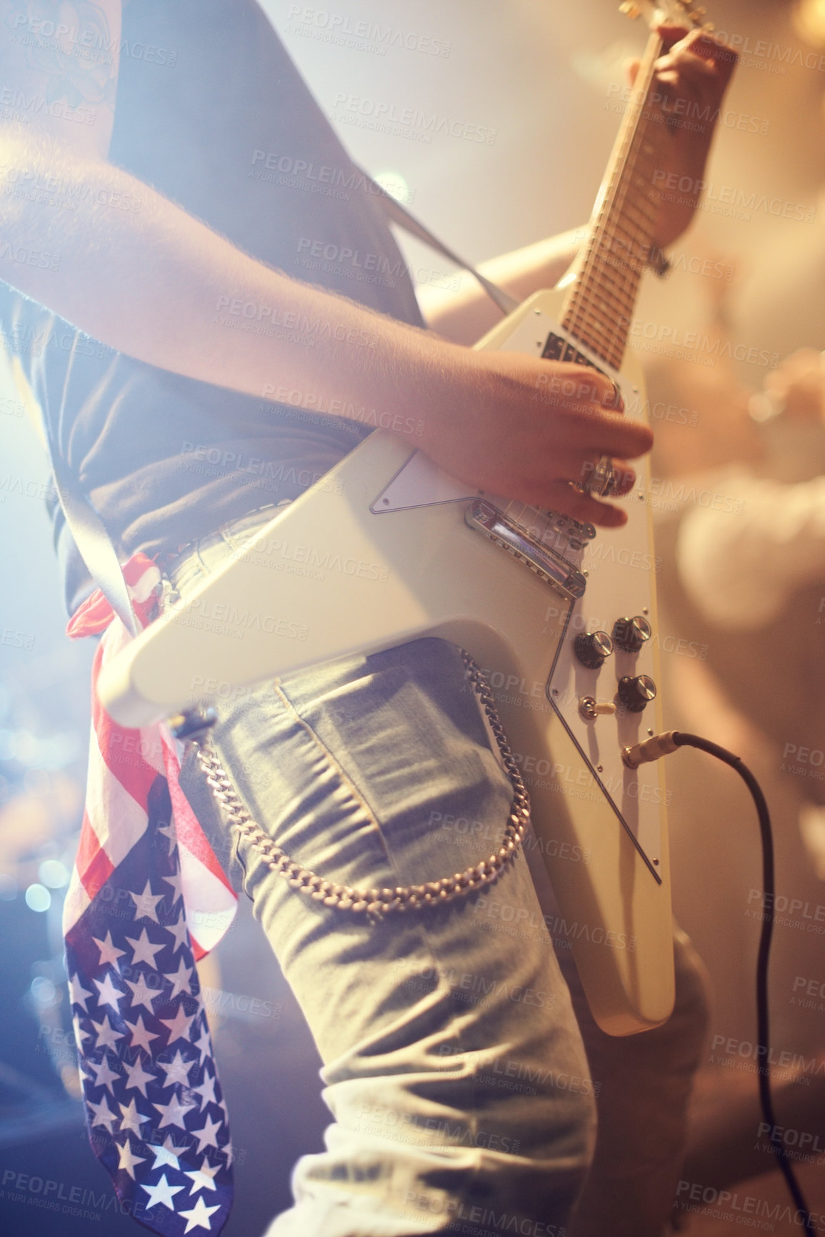 Buy stock photo Guitar, man and performance in USA at night on stage, party and concert for punk, rock and metal music festival. Electric guitarist, hands and musician, artist and band at event with American flag 