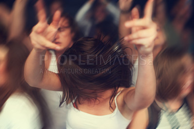 Buy stock photo Dance, motion blur and music festival with a woman moving with rhythm in a crowd at a concert or show. Party, freedom and energy with a young female dancing at a disco or celebration event