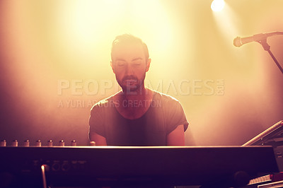 Buy stock photo Piano, man and night club, stage performance and show with band, singer or musician at music festival, live event and entertainment. Artist, electric keyboard or sound instrument at dark rock concert
