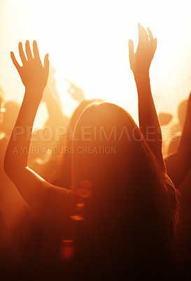 Buy stock photo Woman, live and festival with arms raised to listen, music and dance with crowd, cheering and dancing to performance on stage. Audience, enjoy and singing with loud, sound and partying with band. 