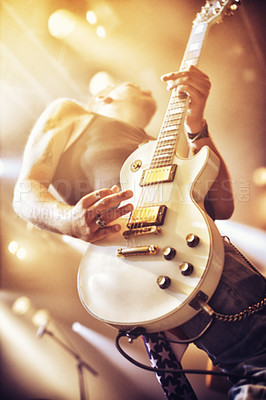 Buy stock photo Low angle view of a guitarist on stage at a gig. This concert was created for the sole purpose of this photo shoot, featuring 300 models and 3 live bands. All people in this shoot are model released.