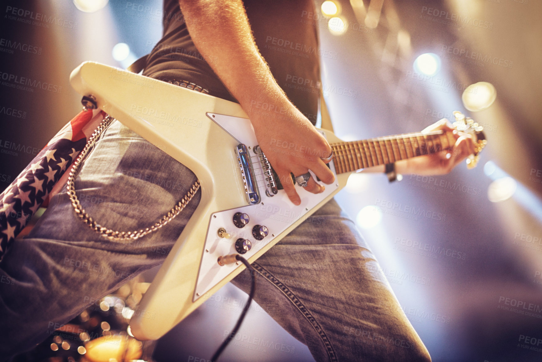 Buy stock photo Low angle view of a guitarist on stage. This concert was created for the sole purpose of this photo shoot, featuring 300 models and 3 live bands. All people in this shoot are model released.