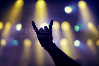 Buy stock photo Cropped shot of a person's hands at a music concert. This concert was created for the sole purpose of this photo shoot, featuring 300 models and 3 live bands. All people in this shoot are model released.