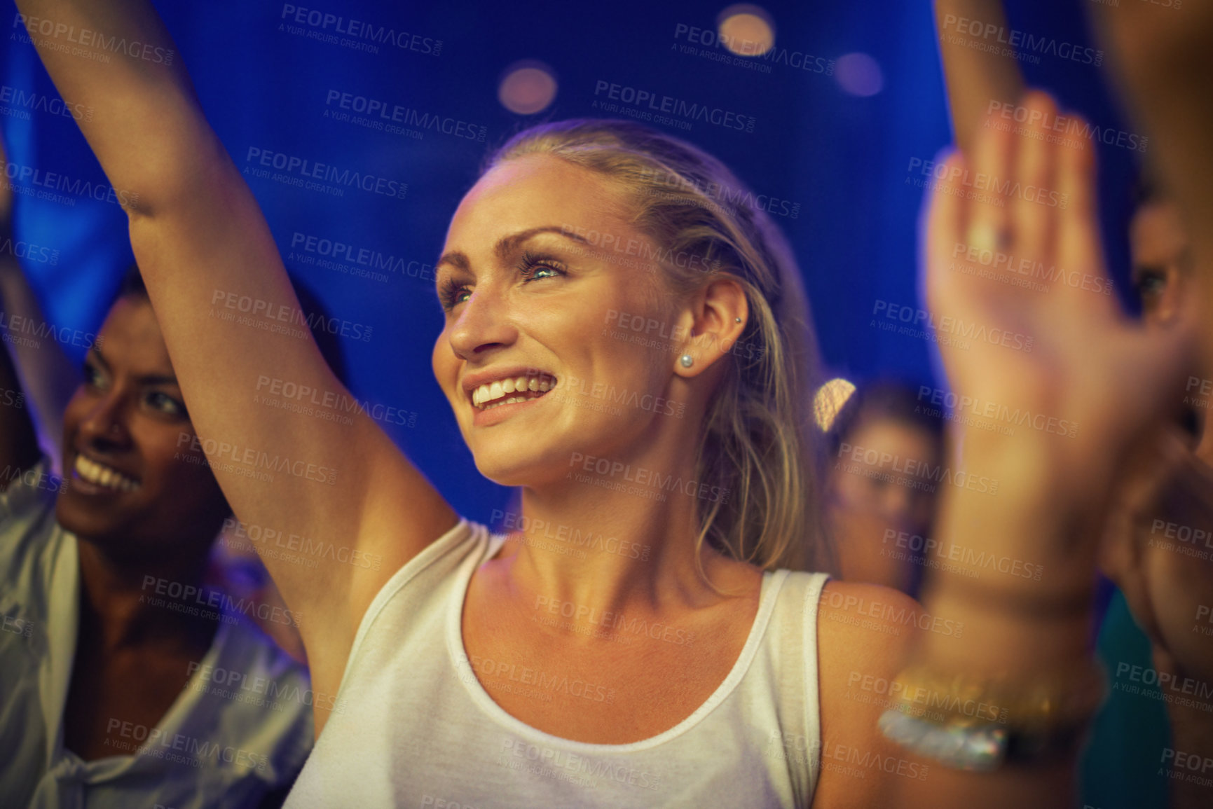 Buy stock photo A pretty blond teen watching her favourite band perform live