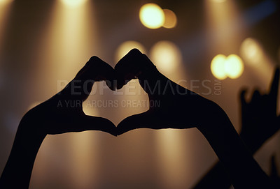 Buy stock photo Person, hands and music concert with heart shape enjoying and loving the performance. Close up a finger sign during a live showing the music band on stage with support while partying with silhouette