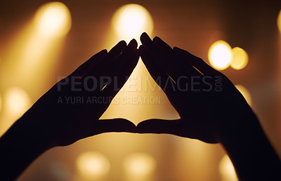 Buy stock photo Cropped shot of a person's hands at a music concert