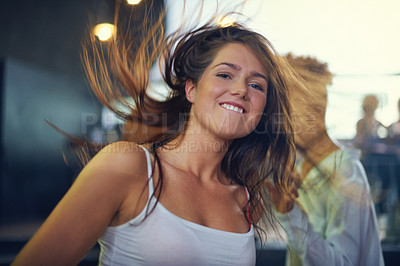 Buy stock photo Young woman dancing to the music at a concert. This concert was created for the sole purpose of this photo shoot, featuring 300 models and 3 live bands. All people in this shoot are model released.